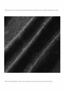 Close-up macro view of high-quality 230g vintage washed black cotton fabric texture for T-shirts