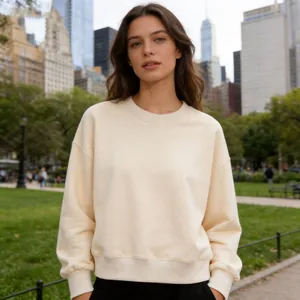 Premium cream white short cotton crewneck sweatshirt for women shown in park setting