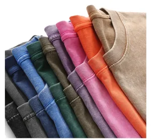 Close-up view of multiple vintage washed cotton t-shirts in various vibrant color options.