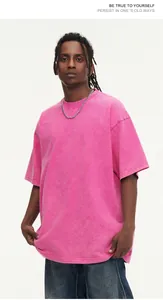 Close-up detail of a heavy 300g vintage washed pink oversized cotton t-shirt with drop shoulders