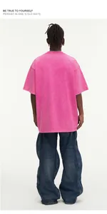 Back view of a vintage pink acid wash oversize cotton t-shirt for streetwear style