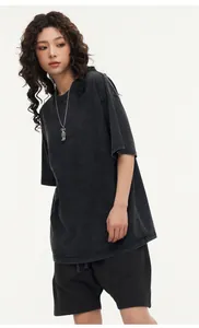 Asian female model wearing vintage oversized black acid-washed cotton t-shirt