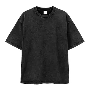 Detail view of the acid wash texture and distressed collar on a grey oversized t-shirt