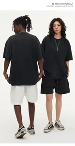 Front and back view of grey oversized washed vintage cotton t-shirt worn by fashion models