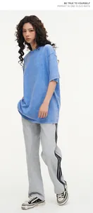 Detailed shot of vintage washed blue heavy-weight cotton oversize t-shirt for men and women