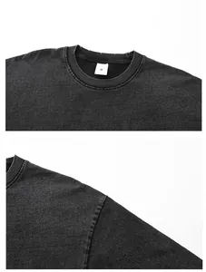 Close-up detail of distressed collar and shoulder seam on washed snowflake grey T-shirt