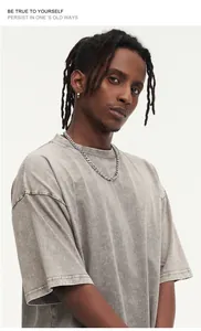 Vintage washed gray oversize cotton t-shirt with distressed texture for urban streetwear