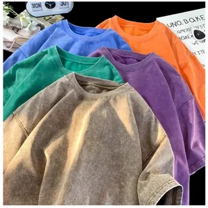 Macro view of heavyweight distressed acid wash T-shirts in multiple vintage colors