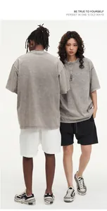 Detailed view of vintage washed oversize cotton t-shirt with a grey snowy texture.
