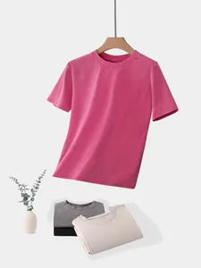 Detail of washed pink cropped T-shirt with folded color variants on grey background.