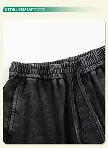 Macro detail view of the elastic drawstring waistband on 350g heavy washed black sweatpants