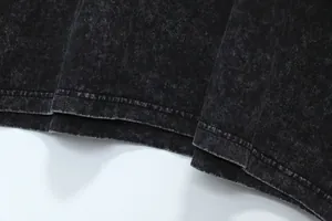 Detailed view of the heavy-weight washed distressed fabric on a faux two-piece long sleeve tee