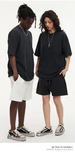 Streetwear oversized washed distressed heavy cotton T-shirts worn by models in studio