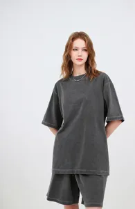 Close-up detail of oversized 260g grey washed cotton t-shirt with vintage faded look
