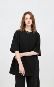 Detail showing the vintage washed-out texture of the black oversized cotton T-shirt
