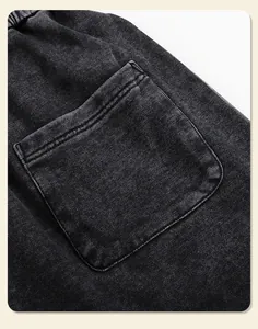 Close-up detail of pocket and texture on heavyweight washed distressed sweatpants.