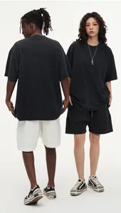 Oversized vintage wash 300g cotton T-shirt styled on models in a studio setting.