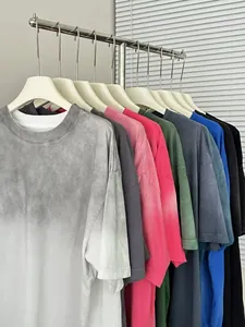 Oversized heavy cotton t-shirts with vintage washed and gradient effects on rack