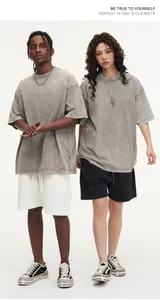 Full length shot of male and female models styling oversized vintage washed grey t-shirts