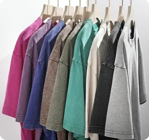 Detailed macro view of heavy cotton acid wash T-shirts shown in multiple vintage colors