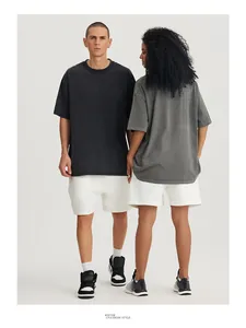 Full view of oversized vintage washed cotton t-shirts on models in a studio setting.