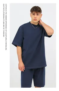 Heavyweight navy washed cotton oversize t-shirt on a male model with aesthetic text