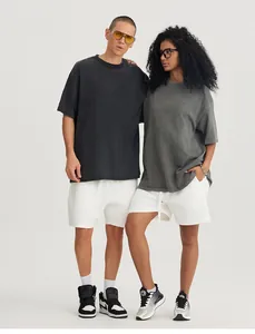 Detailed view of male and female models wearing 280G vintage washed oversized cotton t-shirts