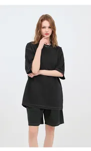 Washed black oversized vintage cotton t-shirt with a distressed look shown on a model