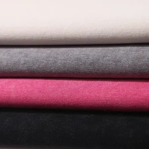Close-up of vintage washed ribbed fabric in beige, grey, pink, and black for tank tops