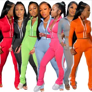 Stylish two-piece women's sports set with zip jacket and side stripe leggings in vibrant colors