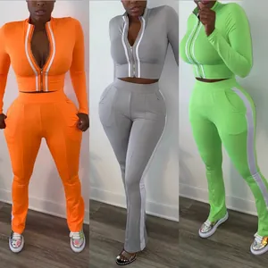 Detailed view of the women's two-piece sports casual set in orange, gray and green.