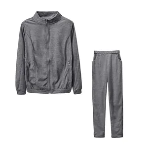 Women's grey two-piece casual tracksuit set with a zip-up jacket and matching pants.