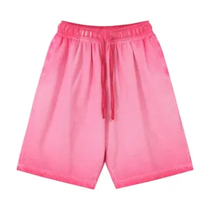Vintage washed pink cotton drawstring shorts with a retro distressed gradient texture