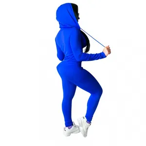 Rear view of a royal blue hooded sweatshirt and matching leggings two-piece athletic set