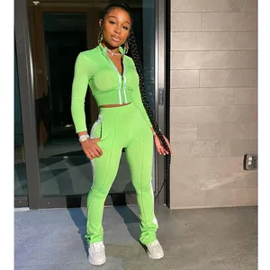 Neon green two-piece tracksuit set with white side stripes and stacked leggings