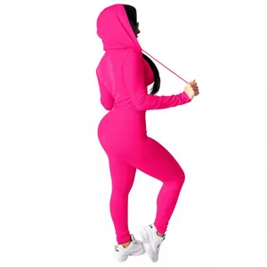 Side view of hot pink 2-piece tracksuit set with hooded zip jacket and leggings