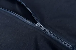 Close-up of smooth plastic zipper on black casual autumn/winter two-piece set for women