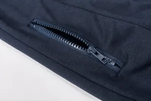 Close-up of high-quality zipper detail on navy casual sportswear set