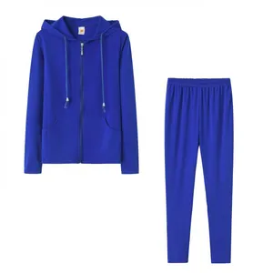 Women's royal blue two-piece tracksuit set featuring a zip-up hoodie and slim joggers
