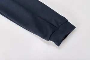Close-up detail of the dark navy ribbed cuff on a casual knit loungewear set sleeve.