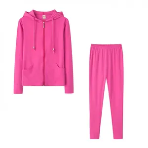 Two-piece fuchsia sports set featuring a zip-up hoodie and high-waisted leggings.