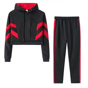 Detail view of women's black and red cropped hoodie and tracksuit pants set