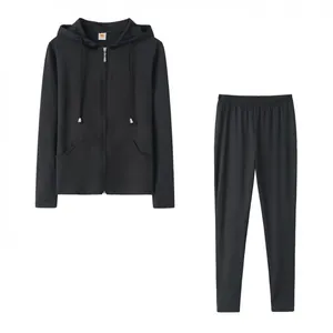 Detailed flat lay presentation of a black zip-up hoodie and matching pants set.