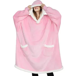 Full view of a pink sherpa-lined hoodie blanket with plush texture and large pockets.