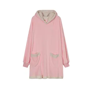 Detailed view of pink wearable blanket hoodie with soft white fleece trim and hood