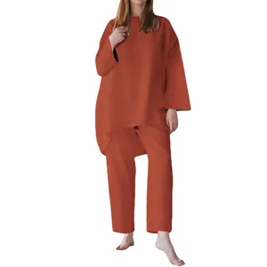 Elegante completo due pezzi da donna terracotta con top a maniche lunghe e pantaloni