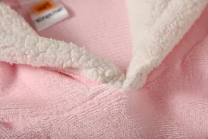 Close-up of pink Sherpa fleece hoodie showing soft texture and collar detail