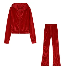 Detail view of red velvet two-piece tracksuit with zip-up hoodie and wide-leg pants set