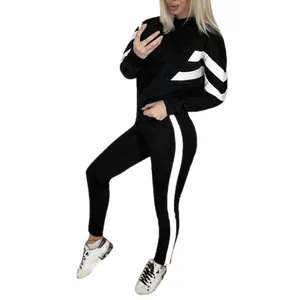 Women's stylish two-piece black tracksuit set featuring sporty white stripes and hoodie.