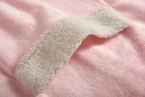 Close-up detail showing the soft pink plush fabric and white sherpa fleece lining texture.